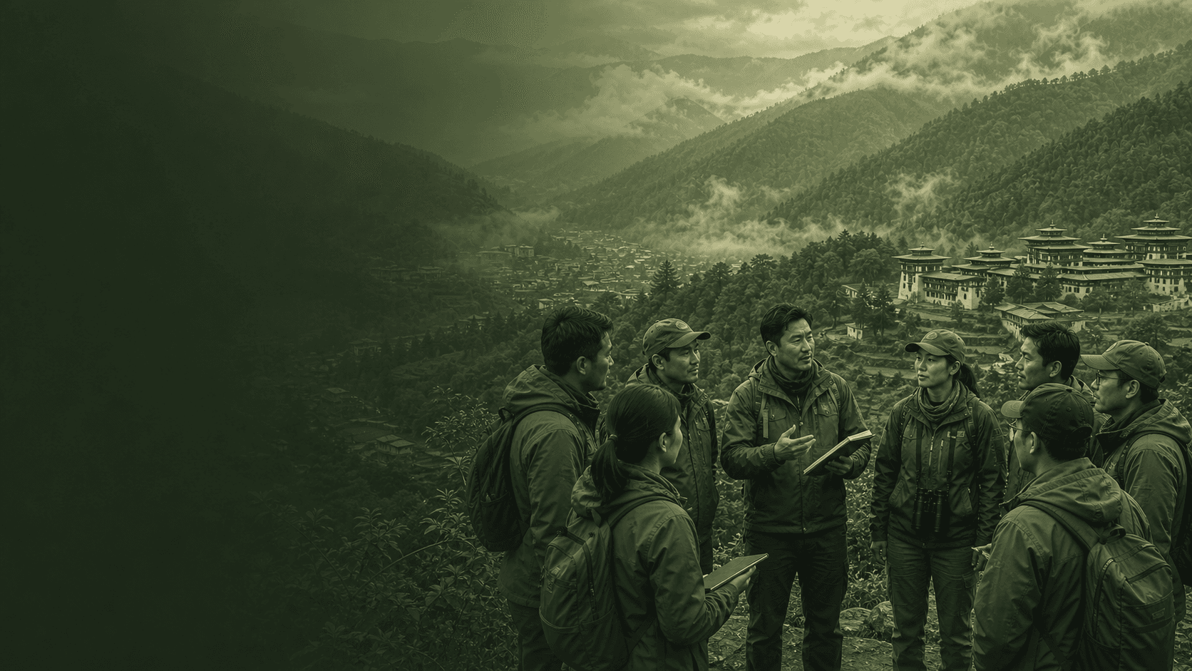 Asian rangers exchanging field knowledge above a Himalayan valley