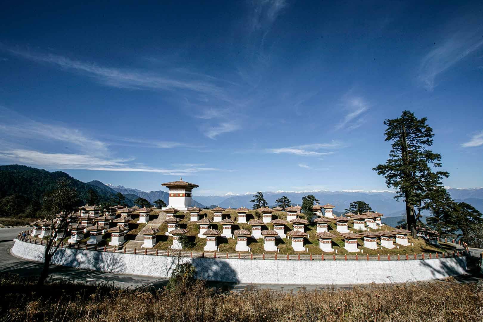 The 108 Druk Wangyal Chortens at Dochula Pass beneath a clear Himalayan sky