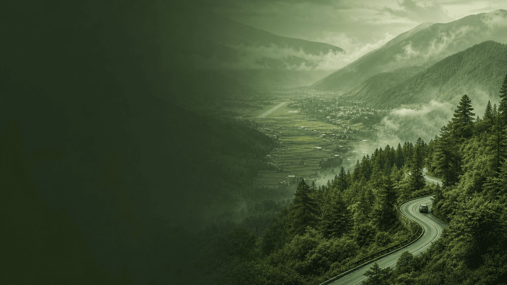 Green-toned Bhutan mountain road and valley travel route toward Thimphu